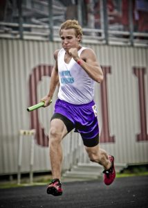 man runs a relay race